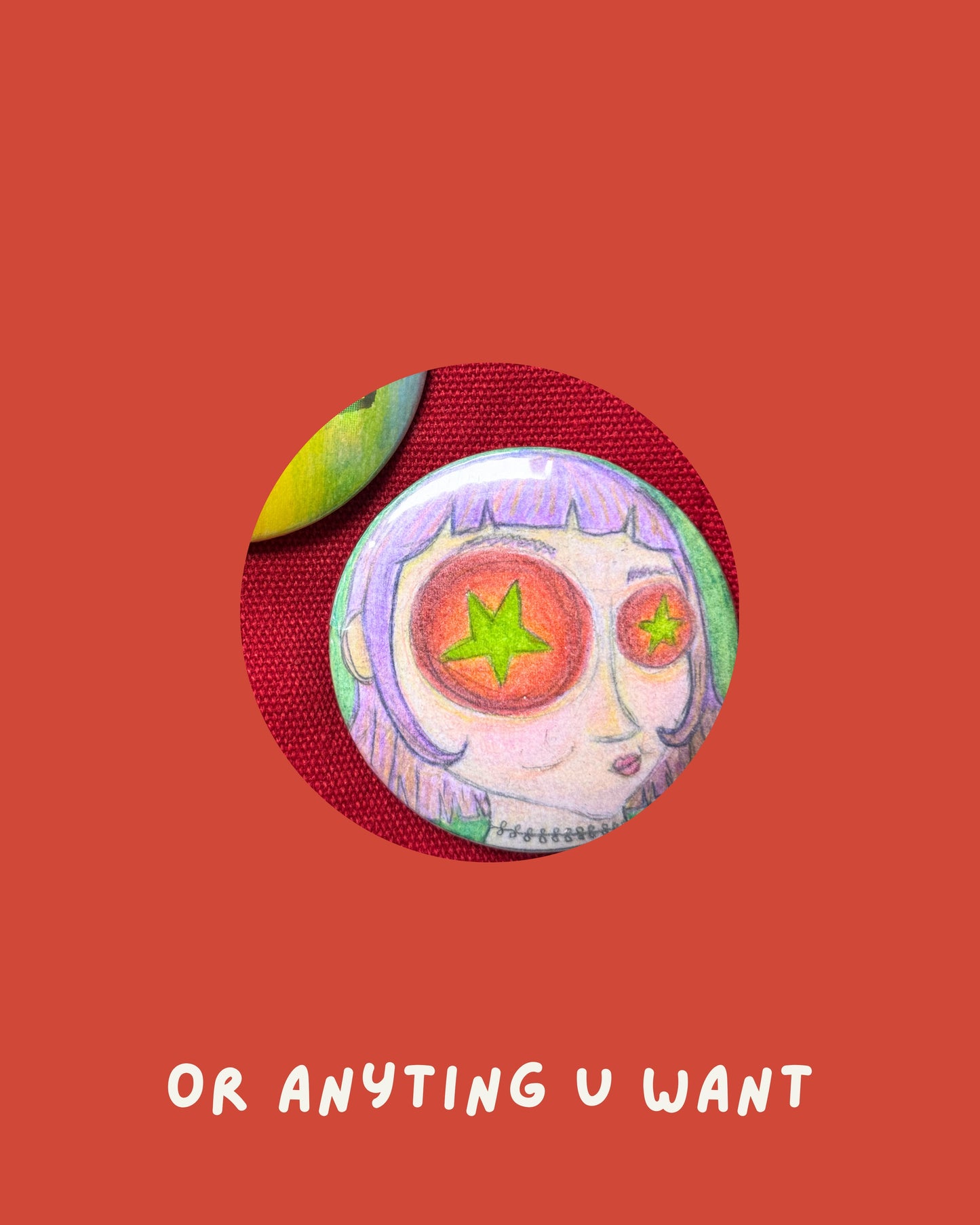 A circular pinback button badge featuring a hand-drawn cartoon face with purple hair and star-shaped eyes, displayed on a textured red circular backing over a solid red background with the text 'OR ANYTING U WANT' in white at the bottom.